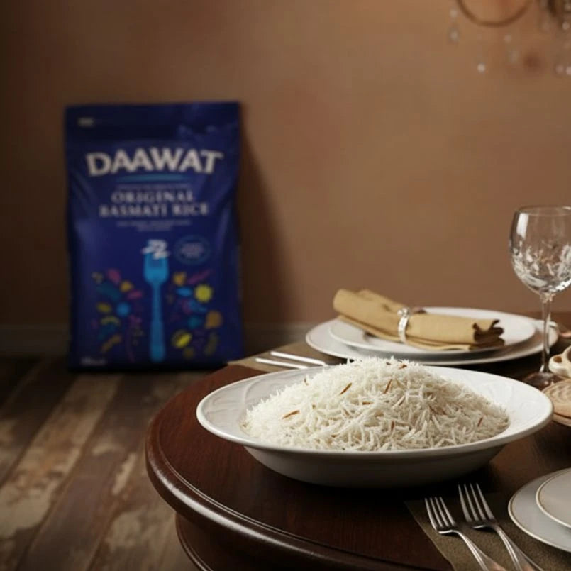 Bowl of rice on a table with a DAAWAT rice package in the background