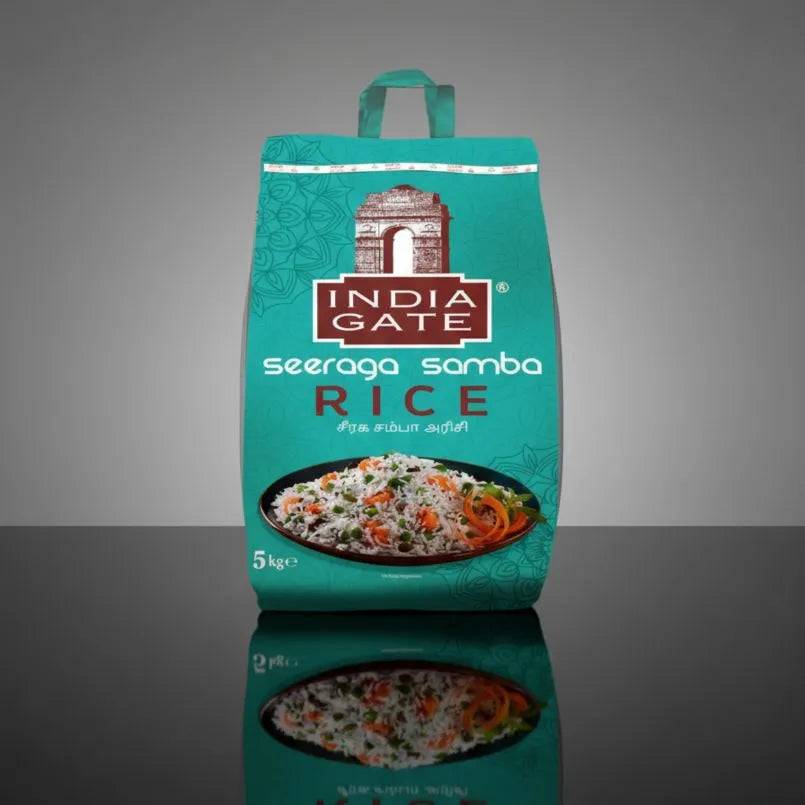 Teal bag of India Gate seeraga samba rice on a reflective surface with a gray background