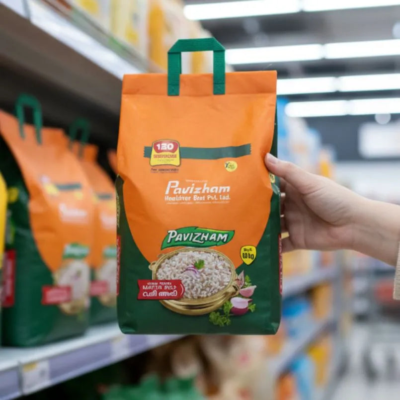 Hand holding a Pavizham branded rice package in a grocery store setting