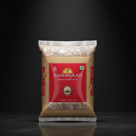 Aashirvaad atta package on a black background