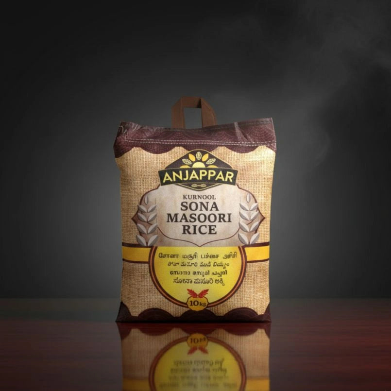 Bag of Anjappar Sona Masoori Rice on a reflective surface with a dark background