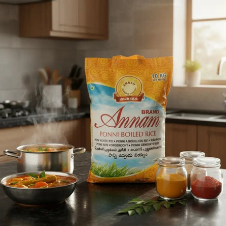 Annam Ponni Boiled Rice package on a kitchen counter with food items and a pot in the background