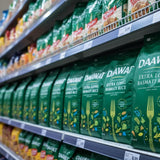 Shelf with green bags of DAAWAT Extra Long Basmati Rice in a grocery store setting.