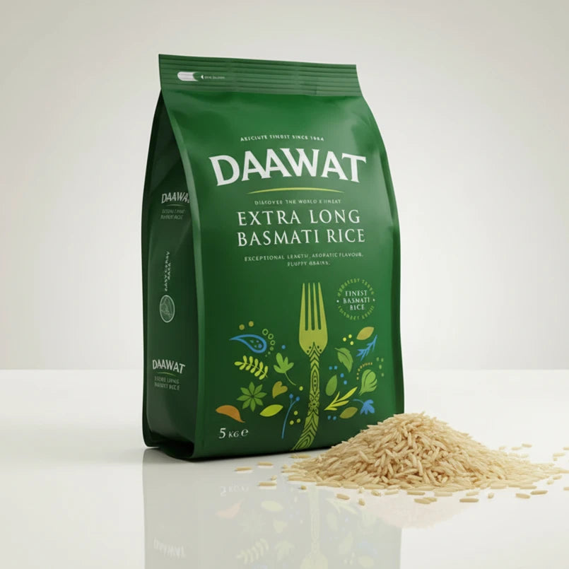 Green bag of DAAWAT Extra Long Basmati Rice with rice on a white surface