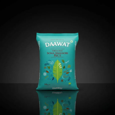 DAAWAT organic Sona Masoori Rice package on a reflective black surface with a dark background