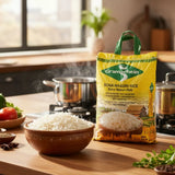 Bag of Gramarheim Sona Masuri Rice on a kitchen counter with a bowl of rice and cooking utensils.