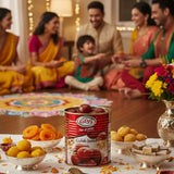 Family gathered around a table with a can of Gulab Jamun, colorful snacks, and a decorative rangoli.