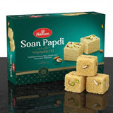 Haldiram's Soan Papdi packaging with pieces of Soan Papdi in front