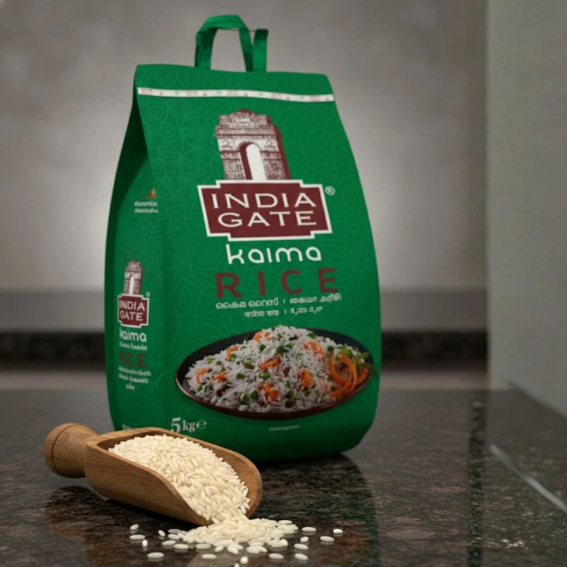 Green bag of India Gate Kaima Rice with a scoop of rice on a dark surface