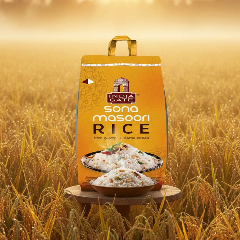 India Gate Sona Masoori Rice bag in a rice field