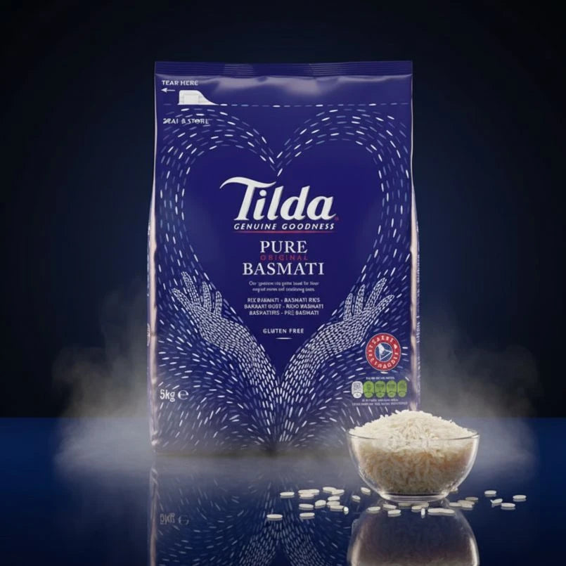 Tilda Pure Basmati rice packaging with a bowl of rice on a dark background